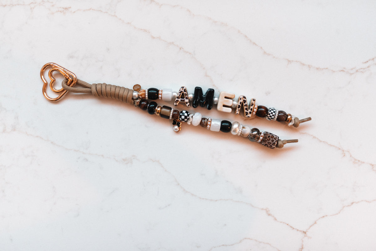 Amen 2-strand loop with leopard, black and cream AMEN letter beads, checkerboard accents, a bow charm and a rose gold heart clasp