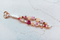 Ask Your Dad 2-strand loop in pink plaid and cream with ASK UR DAD letter beads, a pink daisy and ladybug charm and a rose gold heart clasp