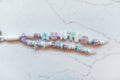 Auntie Pastel 2-strand loop in lavender, mint and aqua with AUNTIE bubble letters, silver accents and a silver bow charm on a white cord