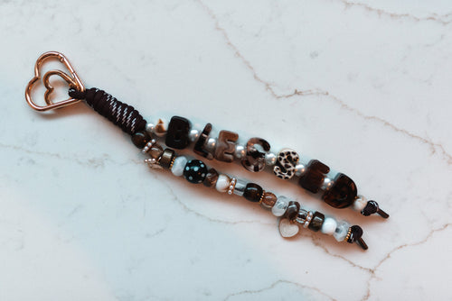 Blessed 2-strand loop in chocolate, tortoiseshell and leopard with BLESSED letter beads, a butterfly charm, a pearl heart and a rose gold heart clasp