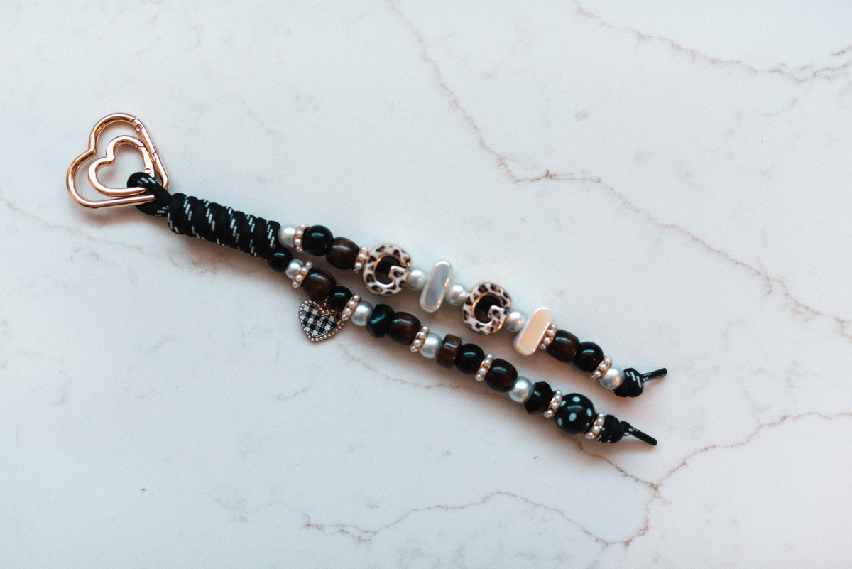 Gigi 2-strand loop in black, espresso and leopard with GIGI letter beads, a gingham heart charm and a rose gold heart clasp