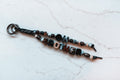Oh Brother 2-strand loop in black, espresso and marbled grey with OH BROTHER letter beads and a gunmetal clasp