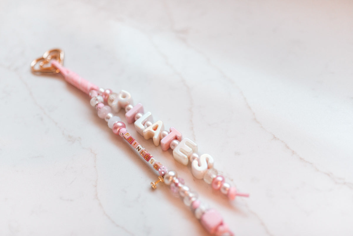 Pilates Princess loop at an angle on white marble