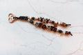 Yay Sports 2-strand loop in chocolate, tortoiseshell and leopard with YAY SPORTS letter beads, a gold clover and horseshoe charm and a rose gold heart clasp